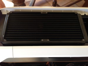 The cooler's radiator mounted at the top of the case